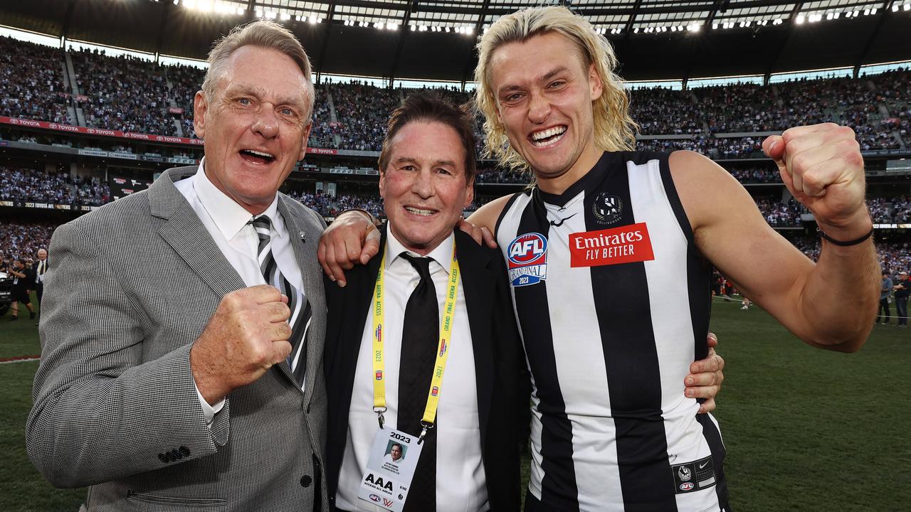 Browne with Darcy and Peter Moore post siren. Picture: Michael Klein