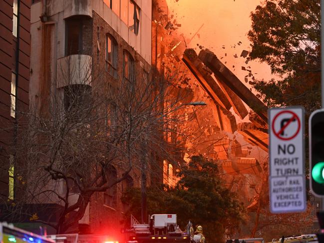 Debris crashed to the ground near firefighters. Picture: AAP