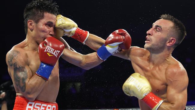 Jason Moloney (right) lands a blow on Vincent Astrolabio. Picture: Mikey Williams/Top Rank Inc via Getty Images