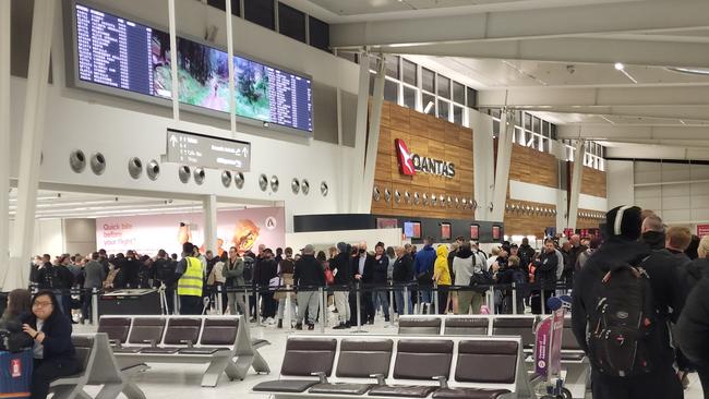 Travellers were forced to wait in long queues at the Adelaide Airport on Tuesday morning.