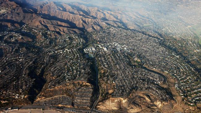 An aerial shot of homes and businesses reduced to rubble by the Palisades Fire in the Pacific Palisades neighbourhood of Los Angeles, California. Picture: AFP