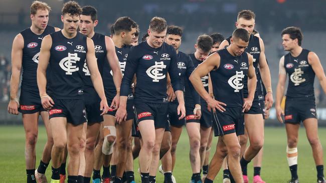 Blues players walk from the ground dejected after a loss which leaves them with just six wins and 10 losses.