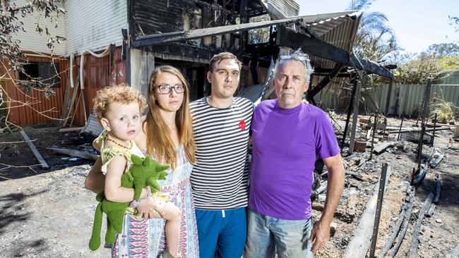 Darcy, Jade, Brandon and Brad Armitage cleaning up house fire at Catalina Street, Loganlea, Wednesday, October 6, 2021 - Picture: Richard Walker