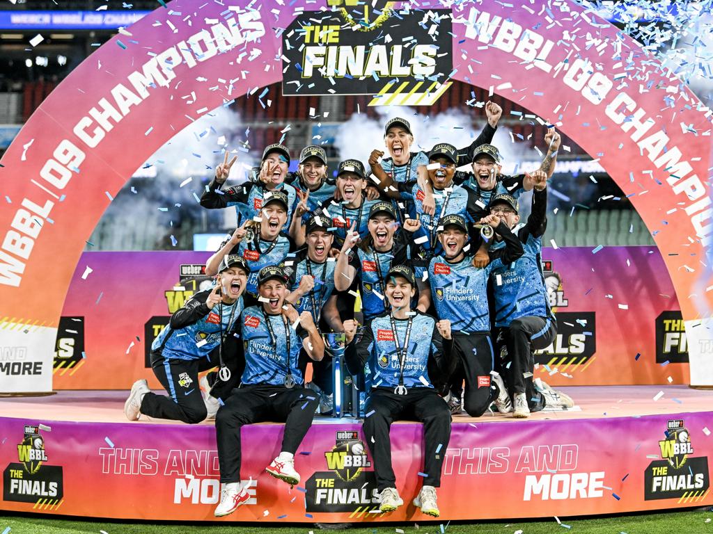 The Strikers celebrate on the podium after winning the 2023 WBBL final at Adelaide Oval. Picture: Mark Brake - CA/Cricket Australia via Getty Images