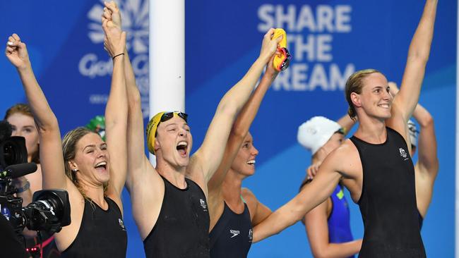 Shayna Jack, Cate Campbell, Emily McKeon, Bronte Campbell salute the crowd after winning gold. Picture: AAP Image/Dave Hunt