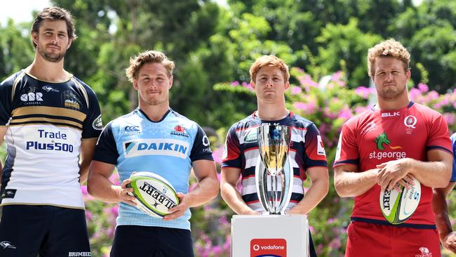 **FILE** A Monday, Feb. 13, 2017 image reissued Monday, April 10, 2017 of Super Rugby captains (L to R) Sam Carter of the Brumbies, Michael Hooper of the Waratahs, Nic Stirzaker of the Rebels, James Slipper of the Reds and Tatafu Polota-Nau (sitting in for Matt Hodgson) of the Western Force posing for a photograph with the competition's trophy during the 2017 Super Rugby Media Launch event in Brisbane. The Western Force and Melbourne Rebels will learn within three days which of them is to be axed, Australian Rugby Union chairman Cameron Clyne says. It's part of a broader restructure of an unwieldy and unpopular Super Rugby competition format, which is to be slashed from 18 teams to 15 after this season, with two South African sides also to go. (AAP Image/Dan Peled) NO ARCHIVING