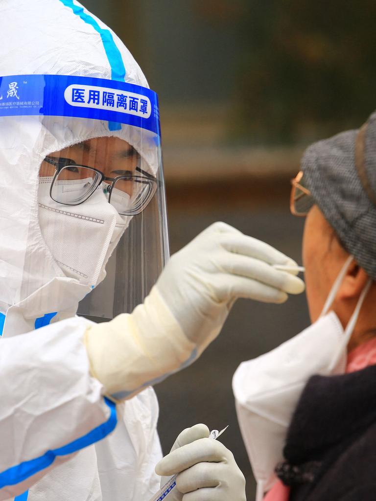 A health worker takes a swab sample from a resident in China. Picture: AFP