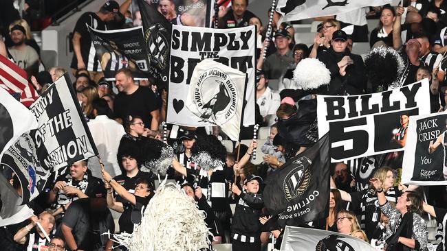 MELBOURNE, AUSTRALIA - MARCH 19: Magpies fans show their support during the round one AFL match between the Collingwood Magpies and the Western Bulldogs at Melbourne Cricket Ground on March 19, 2021 in Melbourne, Australia. (Photo by Quinn Rooney/Getty Images)