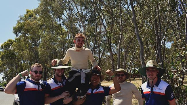 UOW Cameron McDougall on the shoulders of his teammates after a great skid pad performance. Photo: Supplied