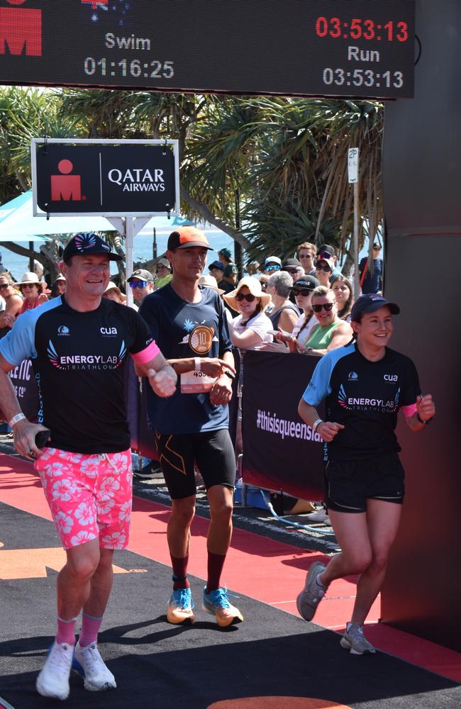 Athletes crossing the finish line at the Sunshine Coast Ironman 70.3 2023.