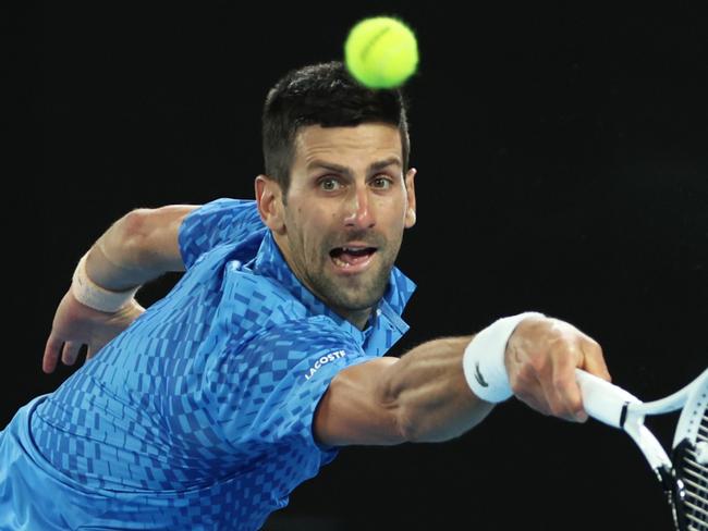 MELBOURNE, AUSTRALIA - JANUARY 29:  Novak Djokovic of Serbia plays a backhand as he returns a serve in the Men's Singles Final match against Stefanos Tsitsipas of Greece during day 14 of the 2023 Australian Open at Melbourne Park on January 29, 2023 in Melbourne, Australia. (Photo by Clive Brunskill/Getty Images) *** BESTPIX ***