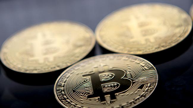 Gold plated souvenir Bitcoin coins arranged for a photograph in London. Picture: AFP