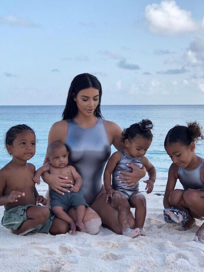 Keeping up! Kim Kardashian with baby Psalm, second from left, with Saint, Chicago and North West (far right).