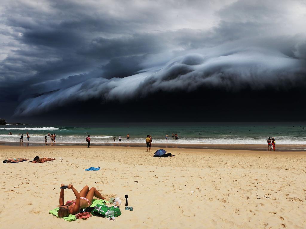 “Storm Front on Bondi Beach” by photographer Rohan Kelly for the Daily Telegraph which won first prize in the Nature singles category shows a massive cloud tsunami looming over Sydney as a sunbather reads, oblivious to the approaching cloud on Bondi Beach, Sydney, Australia, Nov. 6, 2015. Picture: Rohan Kelly/Daily Telegraph via World Press Photo