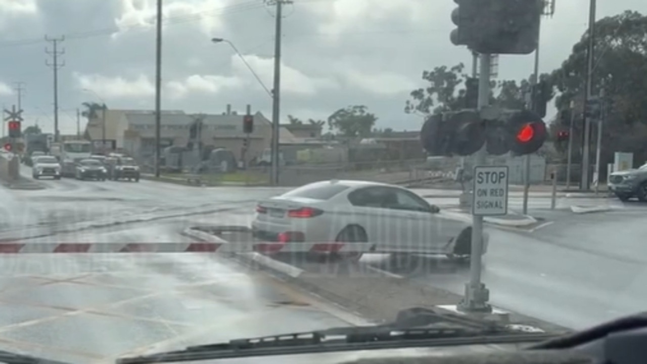 A driver has been filmed narrowly avoiding getting stuck on train tracks in Seaton. Picture: Dashcams Adelaide