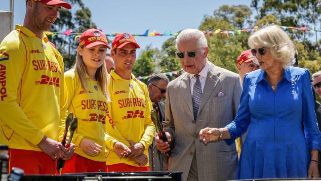 Charles and Camilla cook sausages in Parramatta. Picture: AFP