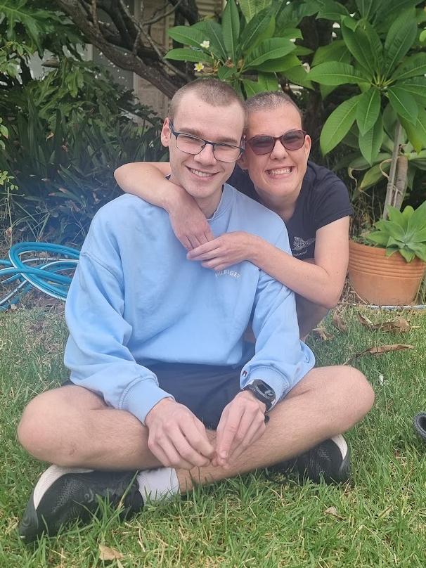 Brooke with her brother Ryan Ridgway after he shaved his head with her. Picture: Supplied