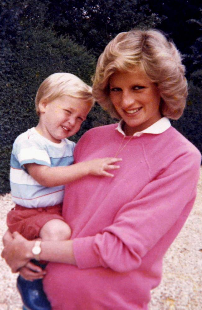 The late Diana, Princess of Wales, holding Prince William while pregnant with Prince Harry. Picture: AFP