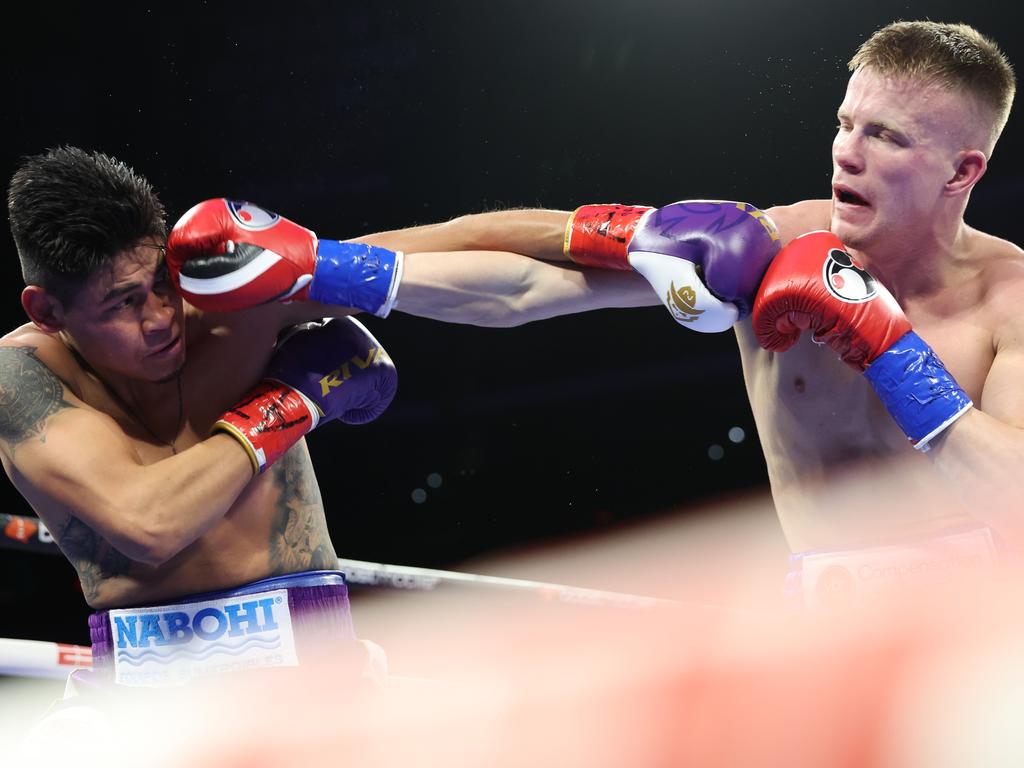 Liam Wilson lands a right hand on Emanuel Navarrete. Picture: Mikey Williams/Top Rank/Getty Images