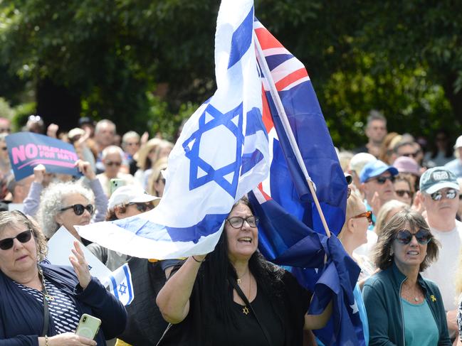 MELBOURNE, AUSTRALIA - NewsWire Photos DECEMBER 08, 2024: People gather for a vigil near the Adass Israel Synagogue of Melbourne after it was destroyed by fire on Friday. Picture: NewsWire / Andrew Henshaw