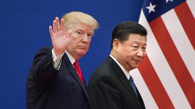 Donald Trump and Xi Jinping leaving a business leaders event at the Great Hall of the People in Beijing.