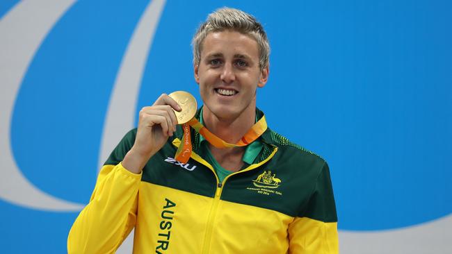 RIO DE JANEIRO, BRAZIL - SEPTEMBER 09: Gold medalist Brenden Hall of Australia celebrates on the podium at the medal ceremony Men's 400m Freestyle - S9 on day 2 of the Rio 2016 Paralympic Games at the Olympic Aquatics Stadium on September 9, 2016 in Rio de Janeiro, Brazil. (Photo by Friedemann Vogel/Getty Images)