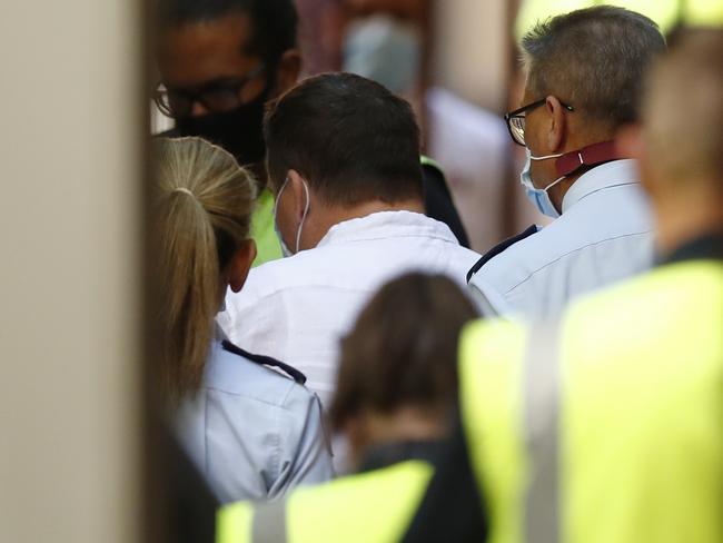 Jarrod Frank is led out of the Supreme Court of Victoria in Melbourne after opening arguments in his murder trial Picture: NCA NewsWire/Daniel Pockett