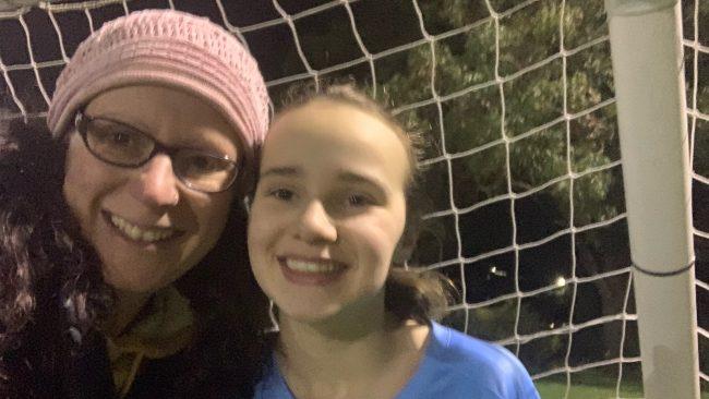 Georgia with her mum Robyn at soccer, one of her favourite pastimes. Picture: Supplied