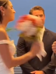 The bride was furious and hit him with her bouquet. Picture: TikTok