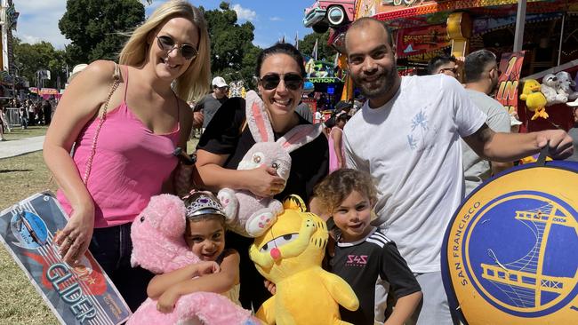 Stonnington friends Felicity Burt, Monique Moussi, Cody Austin and Raiah and Zaria and their huge haul of prizes at Moomba on Saturday, March 11 2023.