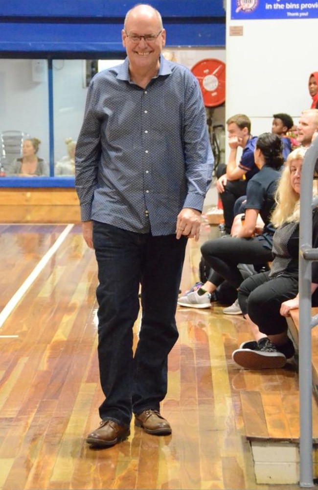 Well-known basketball administrator Allan Woodford walking the sidelines at a Queensland basketball game.