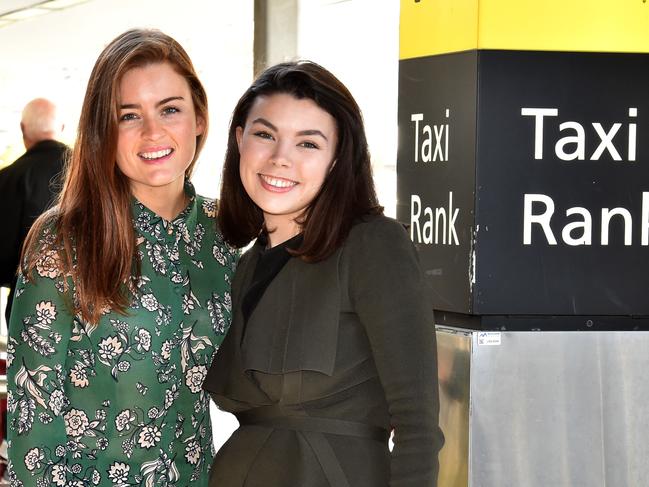 Reporters Aneeka Simonis and Tamsin Rose test drive a Taxi and an Uber trip from Tullamarine. The duo leaving the terminal.Picture: Jay Town