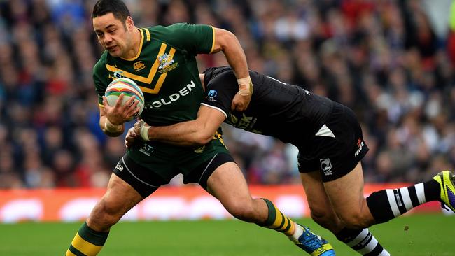 Jarryd Hayne is tackled during the 2013 Rugby League World Cup Final between Australia and New Zealand at Old Trafford in Manchester.