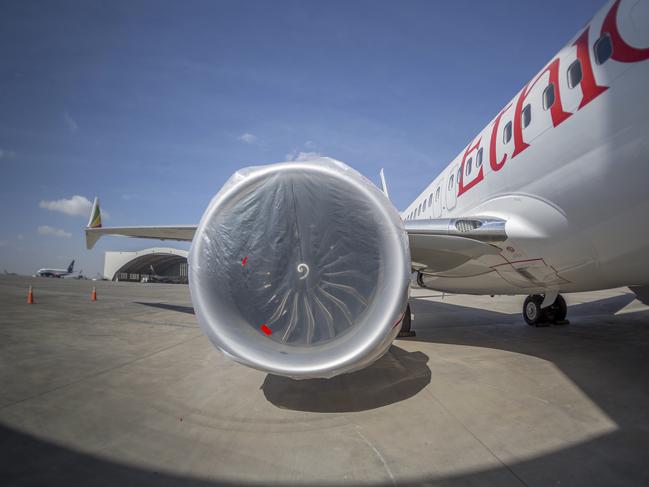 An Ethiopian Airlines Boeing 737 Max 8 sits grounded at Bole International Airport in Addis Ababa, Ethiopia Saturday, March 23, 2019. The chief of Ethiopian Airlines says the warning and training requirements set for the now-grounded 737 Max aircraft may not have been enough following the Ethiopian Airlines plane crash that killed 157 people. (AP Photo/Mulugeta Ayene)