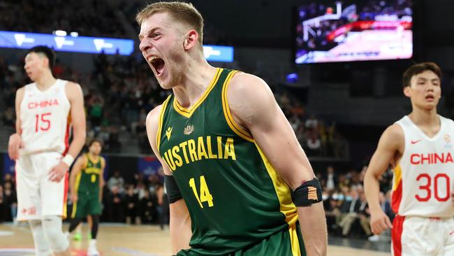 Jack White roars after a huge dunk against China. Picture: Kelly Defina/Getty Images