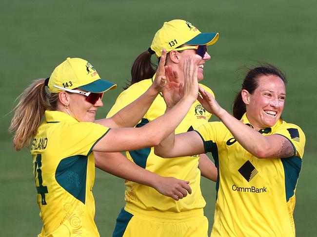 BRISBANE, AUSTRALIA - DECEMBER 05: Megan Schutt of Australia celebrates a wicket during game one of the Women's One Day International Series between Australia and India at Allan Border Field on December 05, 2024 in Brisbane, Australia. (Photo by Chris Hyde/Getty Images)