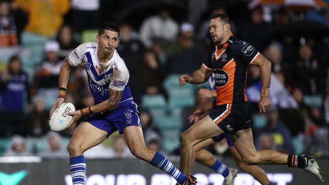 SYDNEY, AUSTRALIA - MAY 20: Jeremy Marshall-King of the Bulldogs passes during the round 11 NRL match between the Wests Tigers and the Canterbury Bulldogs at Leichhardt Oval on May 20, 2022 in Sydney, Australia. (Photo by Jason McCawley/Getty Images)