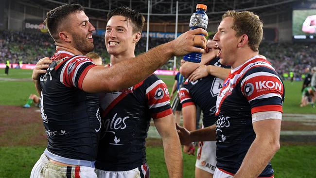 James Tedesco, Sam Verrills of the Roosters and Mitchell Aubusson of the Roosters celebrate following their win over the Raiders in the 2019 NRL Grand Final between the Canberra Raiders and the Sydney Roosters at ANZ Stadium in Sydney, Sunday, October 6, 2019. (AAP Image/Dan Himbrechts) NO ARCHIVING, EDITORIAL USE ONLY