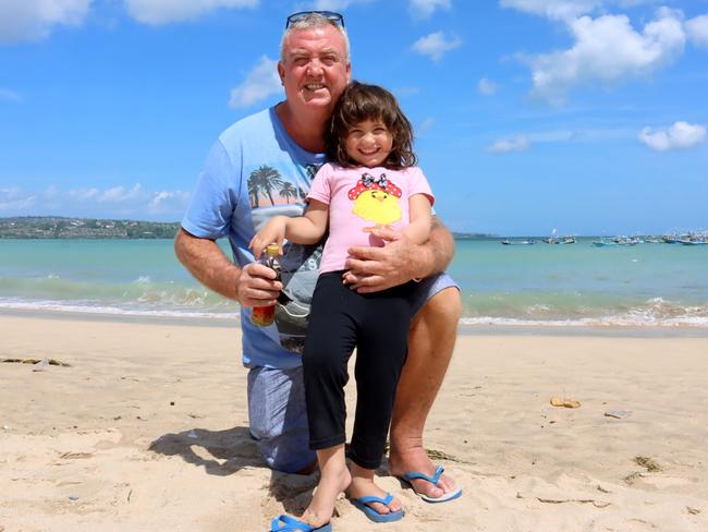 Australian Phillip Burchett, 58, with daughter Charli Mia Burchett, 4, in Bali. Picture: Lukman S. Bintoro.