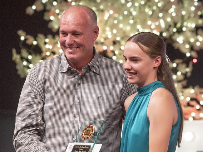 Chloe Denning received the Junior Rising Star award from Darren Holmes, Holmes Smash Repairs. Sports Darling Downs Sports Stars of the Year dinner. Saturday, February 11, 2023. Picture: Nev Madsen.