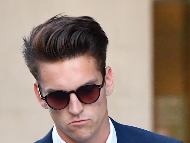 Jacob Watson leaves the District Court in Brisbane, Wednesday, July 26, 2017. Watson is one of three men accused of the rape of another man with a beer bottle on Australia Day 2015. (AAP Image/Darren England) NO ARCHIVING