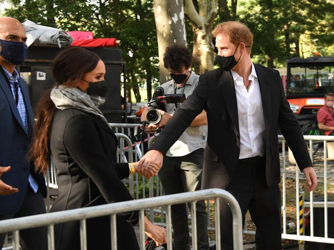 A videographer, centre, captures Meghan Markle and Prince Harry as they tour New York. Picture: Kevin Mazur/Getty Images for Global Citizen