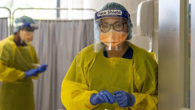 Northern Beaches Hospital COVID-19 clinic. Nurse Jade Doliente in the hot zone waiting to hand over a test for processing. Image Matthew Vasilescu