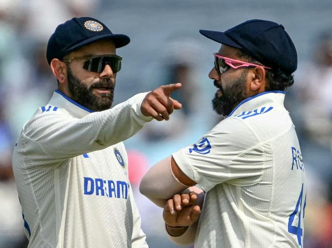 India's Virat Kohli talks with Rohit Sharma during the series against New Zealand. Both men enter what could be their last appearances in Australia under huge pressure. Picture: AFP