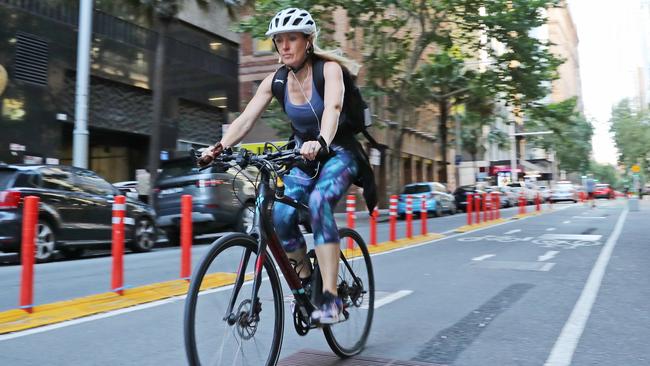 Pictured is a cyclist on a pop up cycleway on Pitt Street. Although initially thought to be temporary, the cycleways now look to be permanent. Picture: Richard Dobson