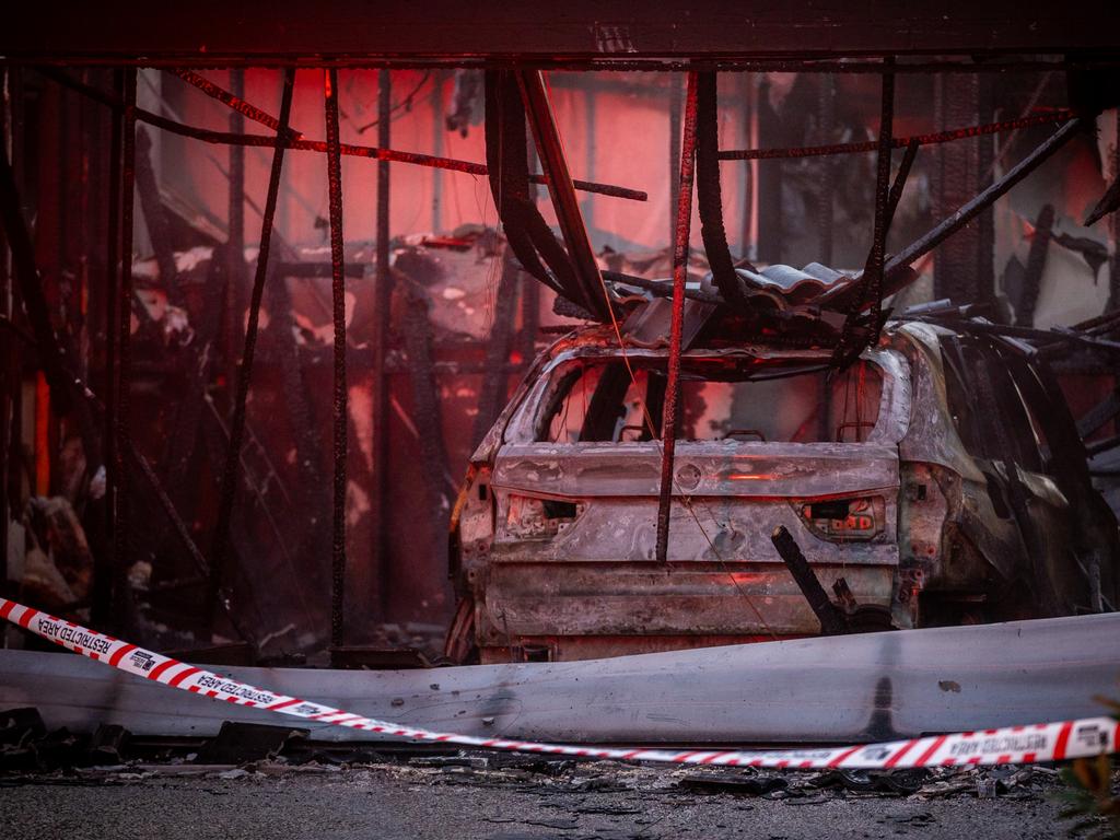 The burnt-out car after it was driven into the garage and set alight. Picture: NewsWire/Jake Nowakowski