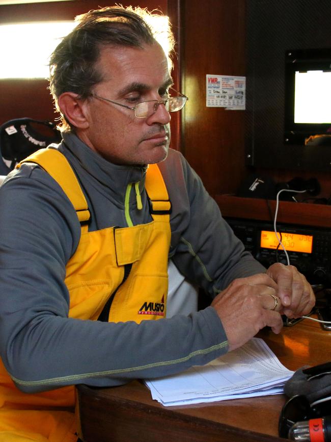 Alex Lomakin, 55, listening to the radio during the Sydney Gold Coast Yacht Race aboard Ocean Gem. Photo: Shaya Laughlin