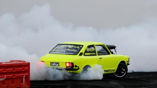 A rev head who allegedly assaulted a man at Summernats has been granted bail. Pictured: a car doing a burnout at Summernats. Picture by Damian Shaw