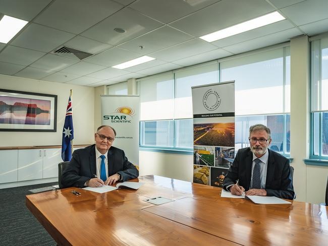 Star Scientific global chairman Andrew Horvath (left) signs the MoU with Central Coast Industry Connect's executive director Frank Sammut to develop a hydrogen powered food manufacturing network on the Central Coast. Picture: supplied