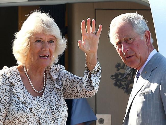 (FILES) This file photo taken on November 15, 2015 shows Britain's Prince Charles (R) and his wife Camilla waving farewell in Perth as they depart Australia. Prince Charles has rejected a cheeky invitation from republicans Down Under to explain why he rather than an Australian should be their next head of state once the Queen dies or steps down, they said on March 21, 2018. The Australian Republican Movement officially asked the heir to the British throne to address a "friendly and respectful" audience during his visit to the country in April for the Commonwealth Games.  / AFP PHOTO / POOL / PAUL KANE